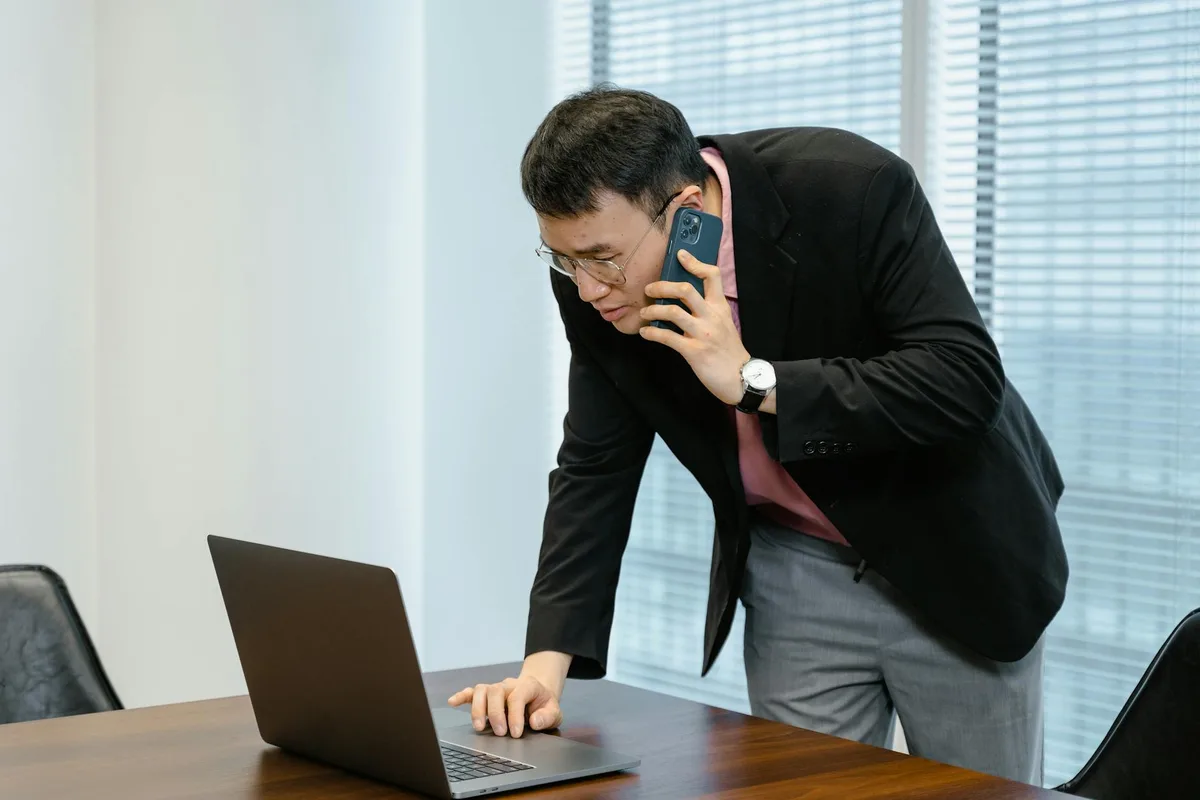 Malaysian entrepreneur completing SSM business registration on a laptop at a desk